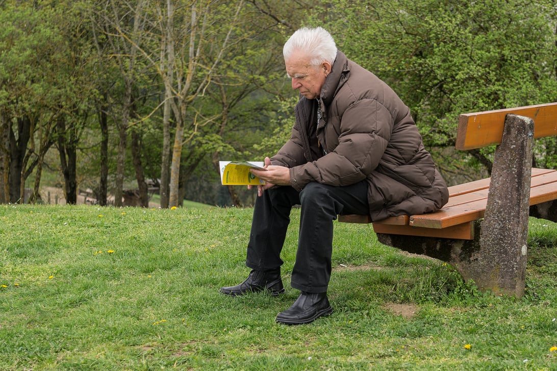 Old Man Reading Outdoors